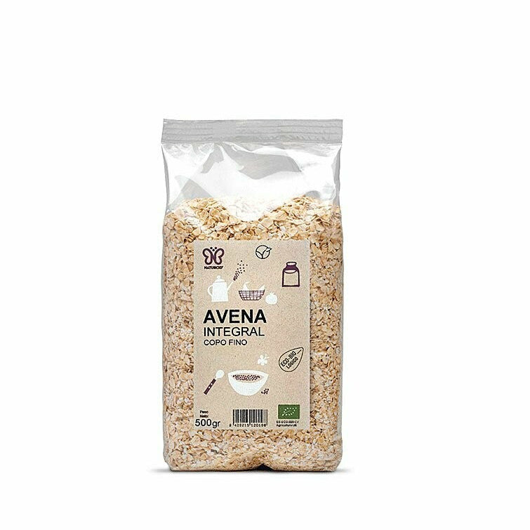 Copos de avena finos integrales, procedentes del laminado de granos de avena.

